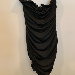Black party/cocktail dress. Strapless Never worn but tags are off